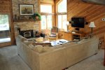 Mammoth Condo Rental Wildflower 48- Living Room with wood burning fireplace and flat screen TV